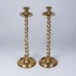 A PAIR OF TWISTED BRASS CANDLESTICKS 52cm high