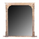 A CARVED OVER-MANTEL MIRROR, EARLY 20TH CENTURY The frame carved with various motifs and flanked