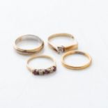 A COLLECTION OF GOLD RINGS Two bands, one gentleman's mini signet ring and one ruby and diamond