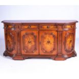 A CONTINENTAL MAHOGANY AND INLAID WALNUT SIDEBOARD The bowfront top with projecting raeded edge