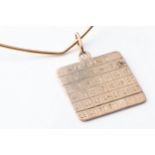 A GOLD CALENDAR PENDANT The 9ct gold 3cm square disc dated 6 August, with a solid wire chain, 40cm