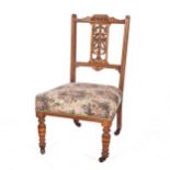 AN EDWARDIAN FRUITWOOD SALON SIDE CHAIR, EARLY 20TH CENTURY With festoon drapery-carved top rail,