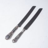 TWO SILVER BREAD KNIVES  The first Viners, Sheffield 1960 the second unmarked, probably Continental