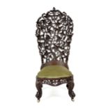 AN ANGLO-INDIAN EBONISED CHAIR