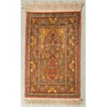 A SILK AND METAL HEREKE PRAYER RUG, TURKEY, MODERN A silk pile with areas of silver colour metal thr