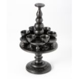 A CASED EBONY ANGLO-BOER PRISONER-OF-WAR EGG CUP STAND