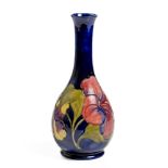 A MOORCROFT 'HIBISCUS' PATTERN BOTTLE VASE