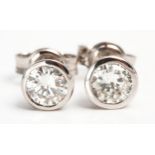 A PAIR OF DIAMOND EAR STUDS