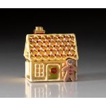 AN ESTEE LAUDER SOLID PERFUME COMPACT, GINGERBREAD HOUSE, 2000