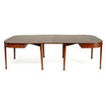 A GEORGE III MAHOGANY EXTENDING DINING TABLE