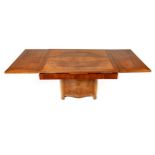 AN ART DECO WALNUT DRAW LEAF EXTENDING DINING TABLE