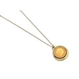 A COIN-MOUNTED PENDANT