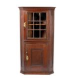 A CAPE TEAK AND YELLOWWOOD CORNER CUPBOARD, 19TH CENTURY