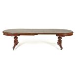 A VICTORIAN MAHOGANY EXTENDING DINING TABLE