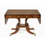 A REGENCY WALNUT LIBRARY TABLE