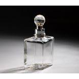 A SILVER-COLLARED CRYSTAL DECANTER, 1910