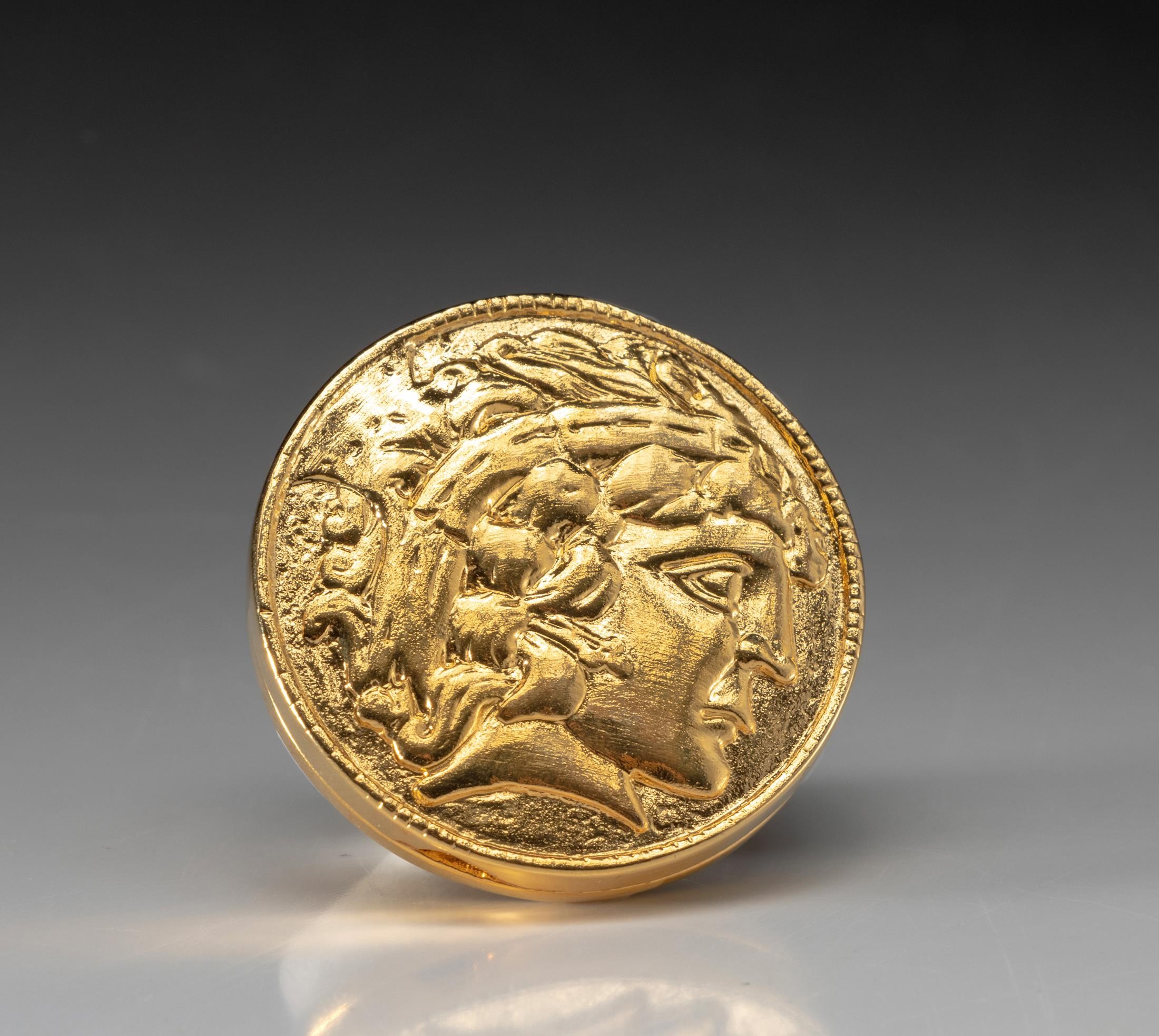 AN ESTEE LAUDER SOLID PERFUME COMPACT, PROSPERITY COIN, 2012