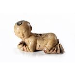 A CHINESE SOAPSTONE CARVING OF A BOY, QING DYNASTY, 19TH CENTURY
