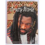 LUCKY DUBE: CRAZY WORLD, A BIOGRAPHY (INSCRIBED BY LUCKY DUBE)
