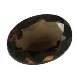 AN OVAL SMOKY TOPAZ 25 CARATS