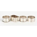 FOUR SILVER NAPKIN RINGS