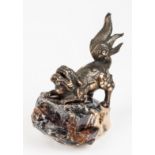 A BRONZE LION DOG SCROLL WEIGHT, REPUBLIC OF CHINA, 1949