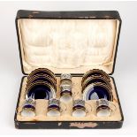AN AYNSLEY CASED DEMITASSE SET WITH SILVER HOLDERS, 1935