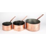 A SET OF THREE TIN-LINED COPPER SAUCEPANS