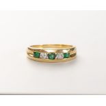 AN EMERALD AND DIAMOND RING