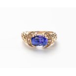 A TANZANITE AND DIAMOND RING