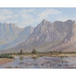 George Paul Canitz (South African 1874 - 1959) RIVERBED WITH MOUNTAINS IN THE BACKGROUND