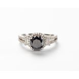 A BLACK AND WHITE DIAMOND RING
