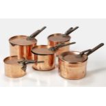 A SET OF FIVE COPPER SAUCEPANS