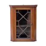 A GEORGE III MAHOGANY HANGING CORNER CUPBOARD