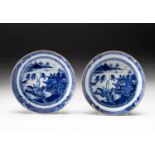 A PAIR OF CHINESE BLUE AND WHITE "VILLAGE HAMLET" SAUCER DISHES, QING DYNASTY, 18TH CENTURY