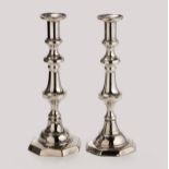 A PAIR OF ELECTROPLATED CANDLESTICKS