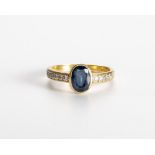 A SAPPHIRE AND DIAMOND RING