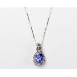 A TANZANITE AND DIAMOND PENDANT