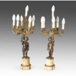 A PAIR OF BRONZE PUTTI SIX-LIGHT CANDELABRA, 19TH CENTURY