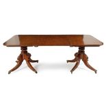 A REGENCY MAHOGANY EXTENDING DINING TABLE, RETAILED BY NORMAN ADAMS, LONDON