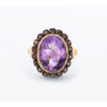 AN AMETHYST AND DIAMOND RING