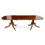 A REGENCY MAHOGANY EXTENDING DINING TABLE