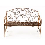 A WROUGHT IRON GARDEN BENCH