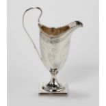 A GEORGE III SILVER MILK JUG, MAKERS MARKS RUBBED, LONDON, 1787