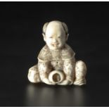 A JAPANESE STAG ANTLER "BOY WITH BOWL" NETSUKE, MEIJI PERIOD, 1868 - 1912