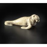 A JAPANESE MARINE TUSK "WALRUS" NETSUKE, MEIJI PERIOD, 1868 - 1912