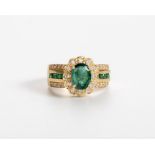 AN EMERALD AND DIAMOND RING