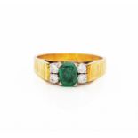 AN EMERALD AND DIAMOND RING