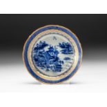 A CHINESE BLUE AND WHITE "VILLAGE HAMLET" SAUCER, QING DYNASTY, 18TH CENTURY