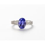 A TANZANITE AND DIAMOND RING